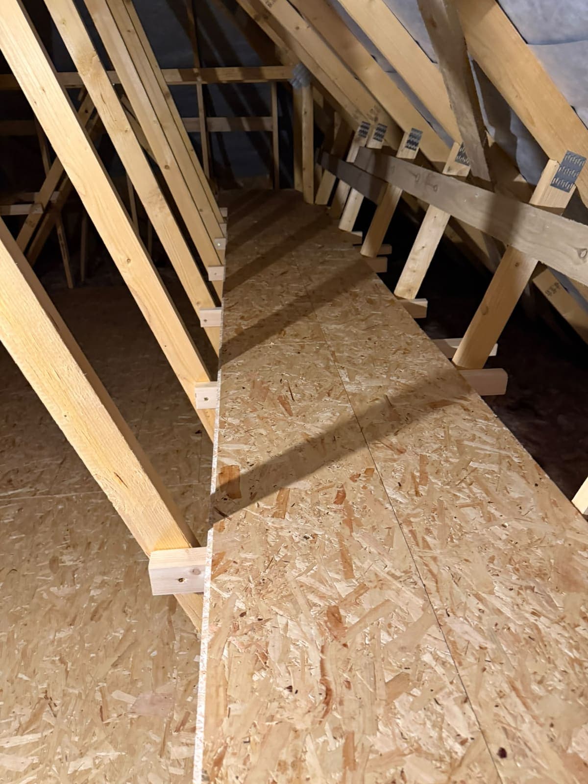 Boarded storage run along the side of the loft