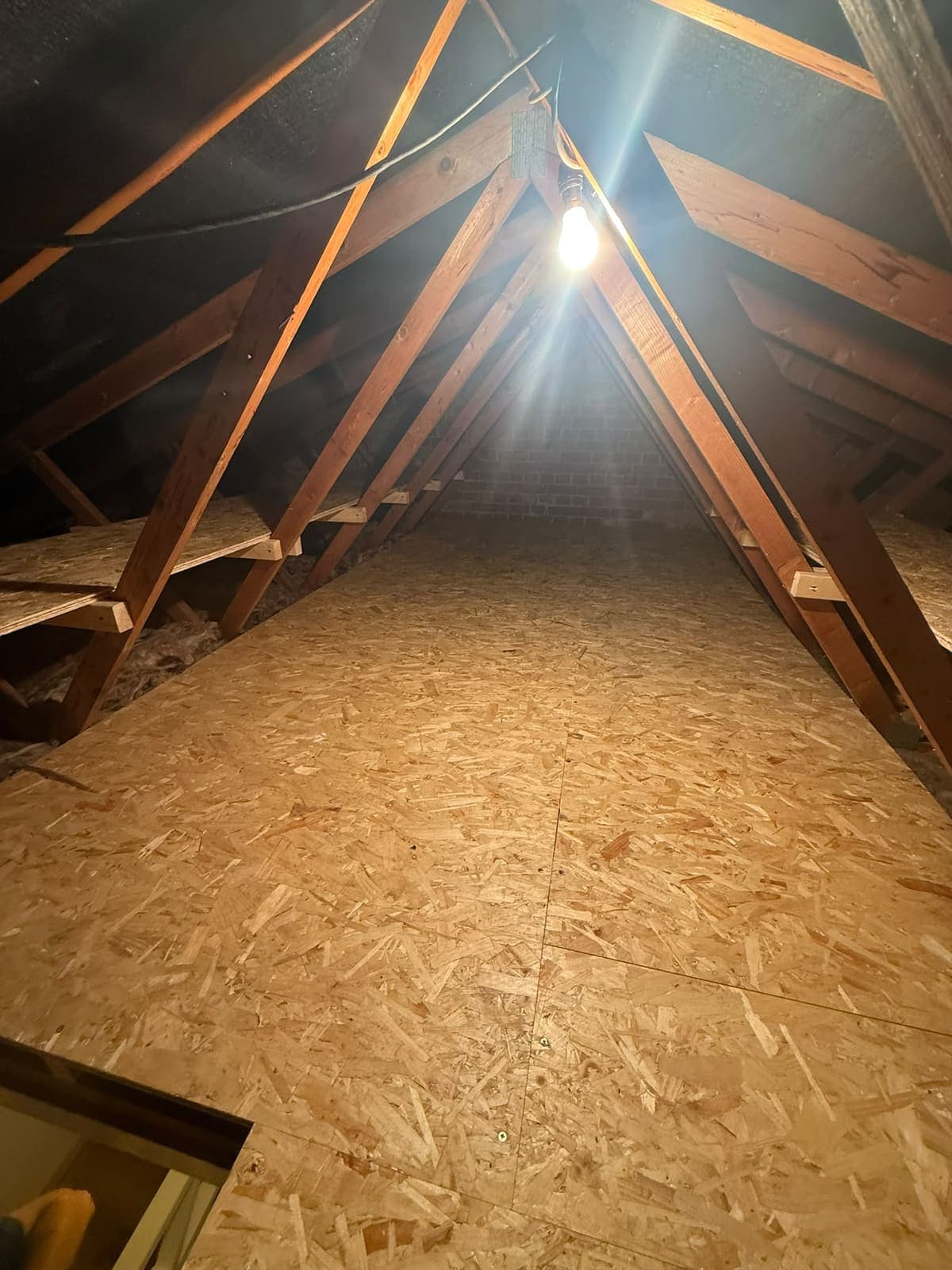 Finished loft boarding running to the gable wall in Sittingbourne