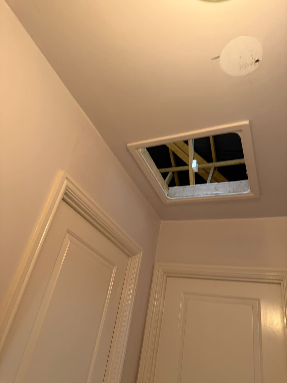 Before: the small original loft hatch seen from the landing