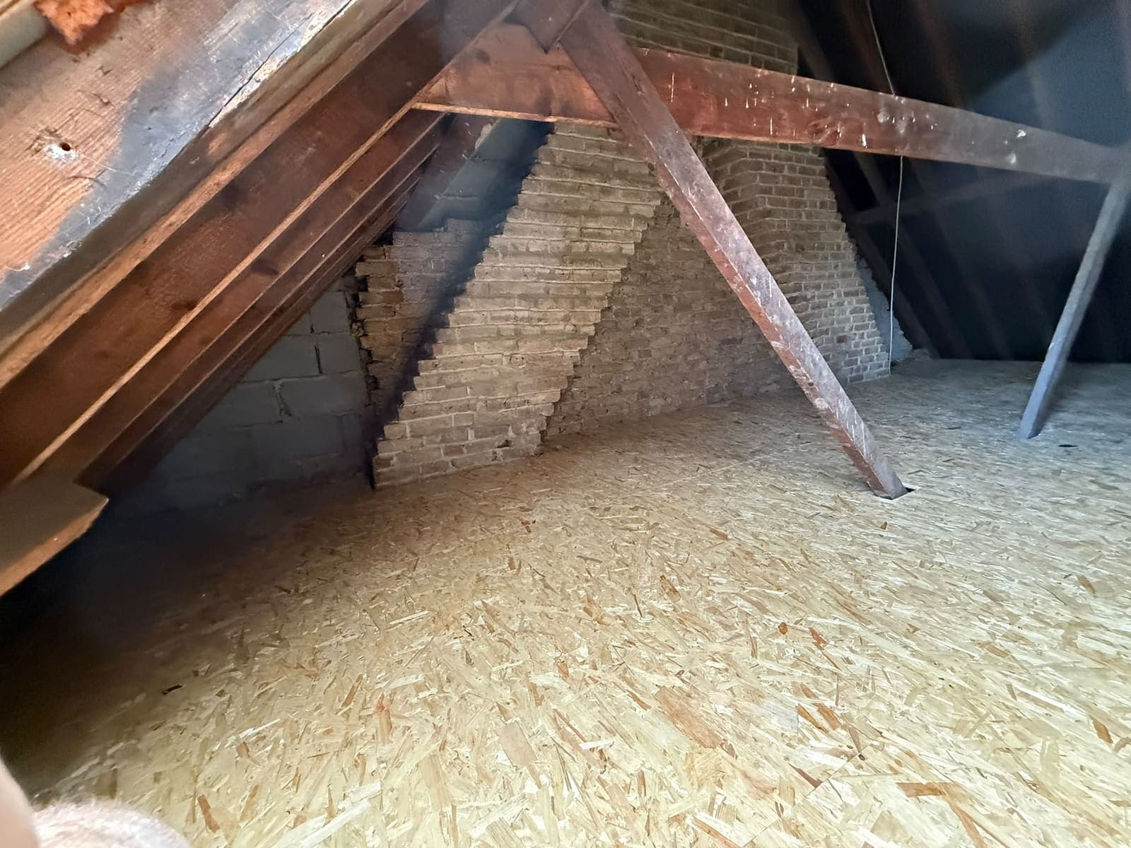 Boarded loft storage floor under a traditional cut roof