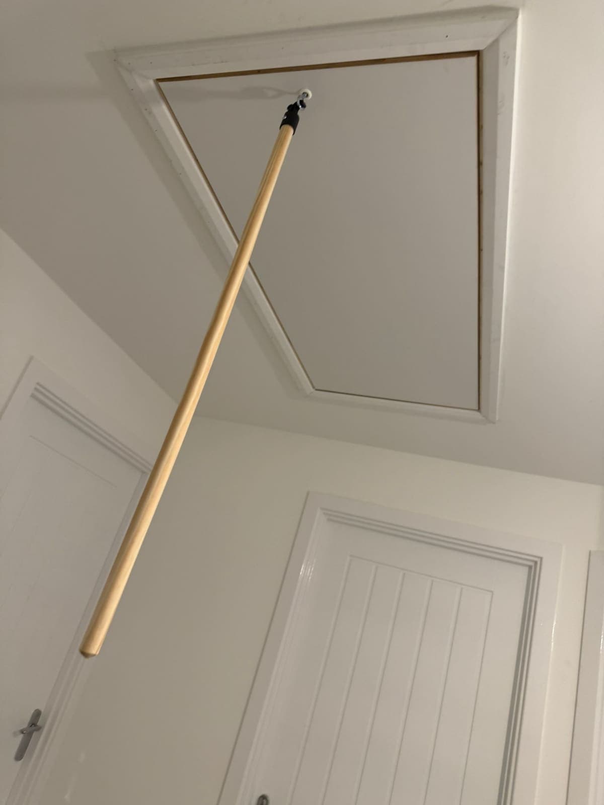 Loft hatch closed, opened with a pole from the landing
