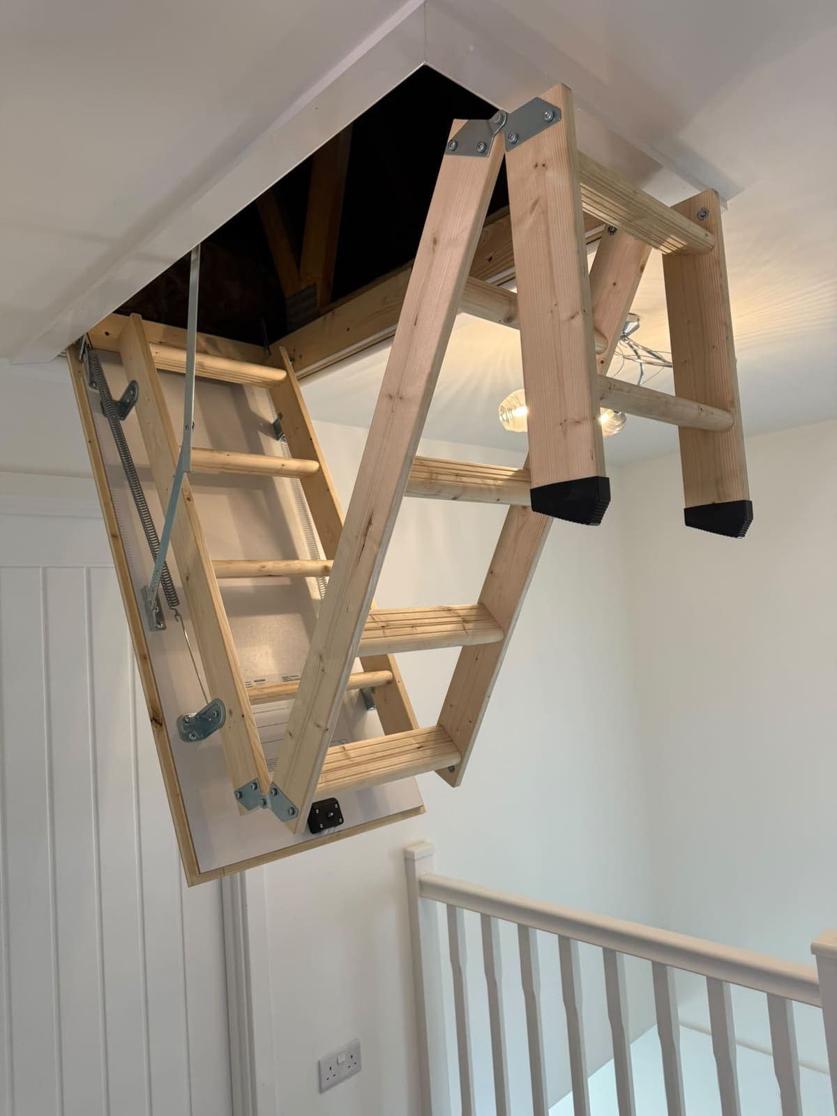 Loft ladder folding down from the hatch