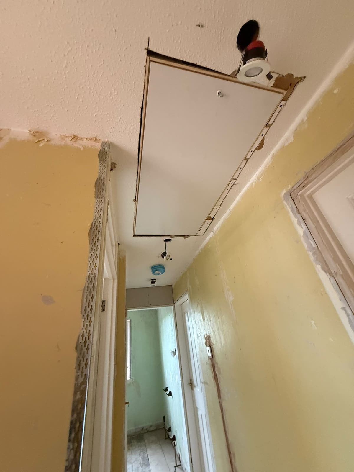 New loft hatch fitted into the hallway ceiling