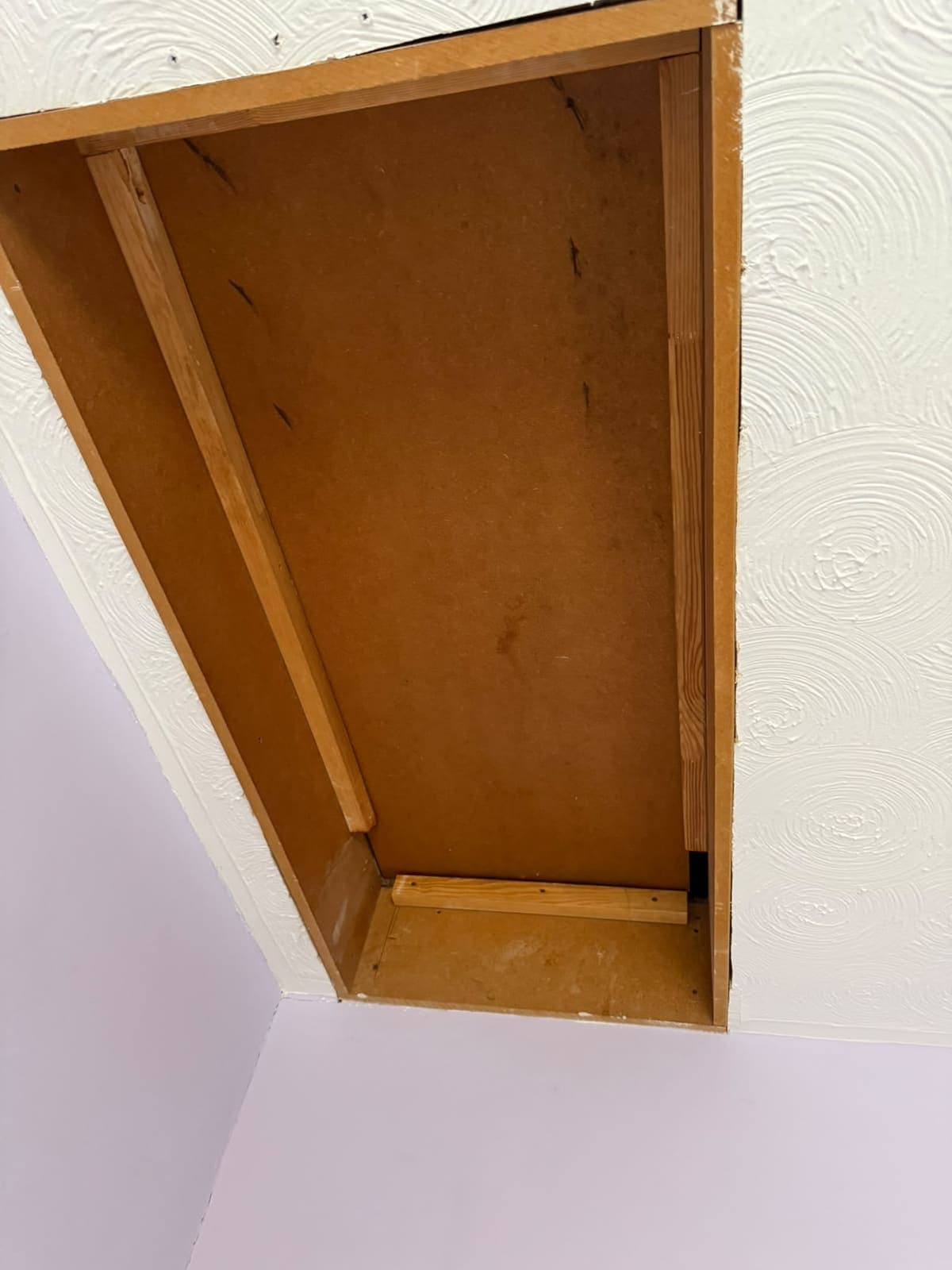 Before: the old boxed loft opening with no hatch door