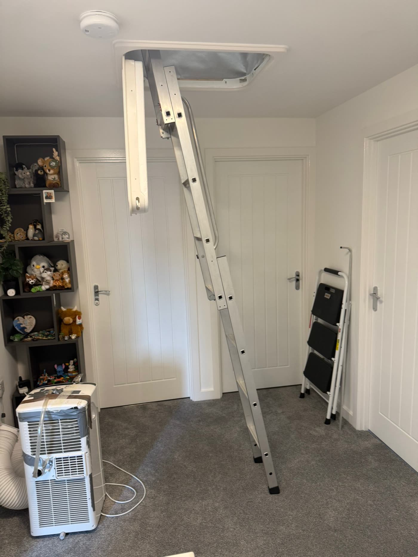 Aluminium loft ladder fitted to a landing by Xtraspace Lofts
